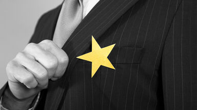 overconfident businessman with star on suit