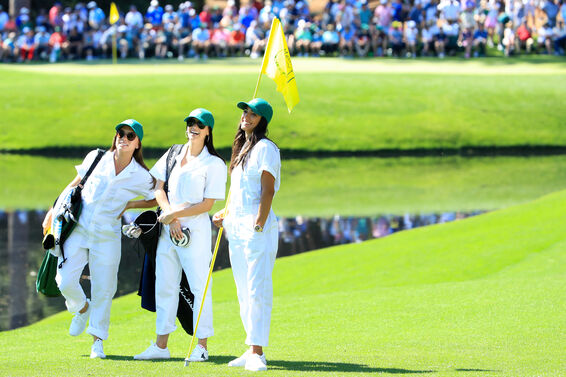 Wives and girlfriends traditionally double as caddies during the Masters Par 3 contest