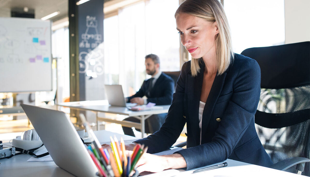 woman writing a business letter in the office