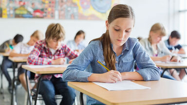 students in classroom adverb quiz practice