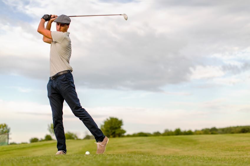 golfer at the top of his backswing