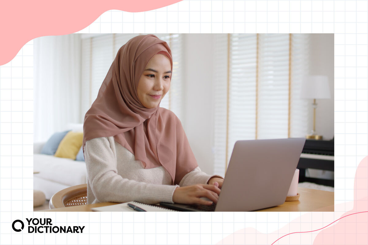 woman typing on laptop