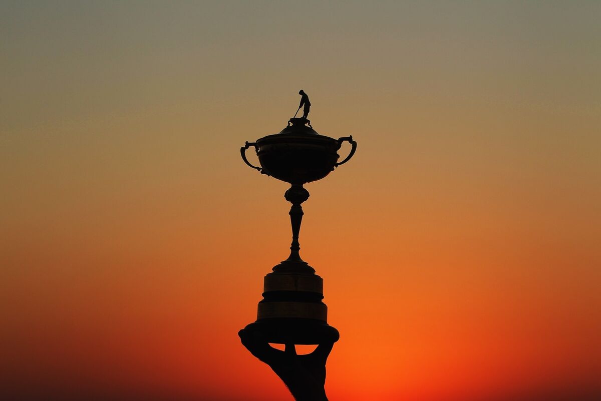 The Ryder Cup trophy against a sunset
