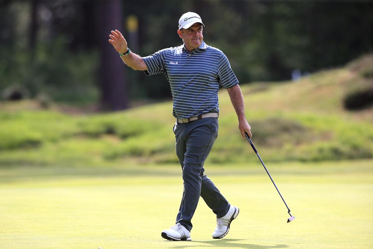 Paul McGinley waving to fans