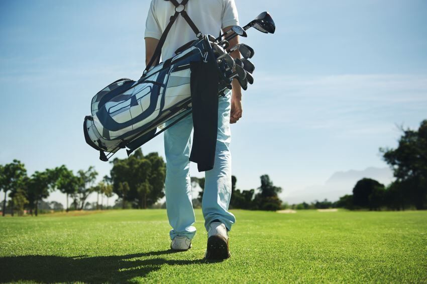golfer with bag on his back