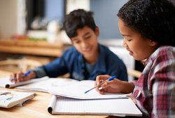 Girl and boy studying together as syntax examples