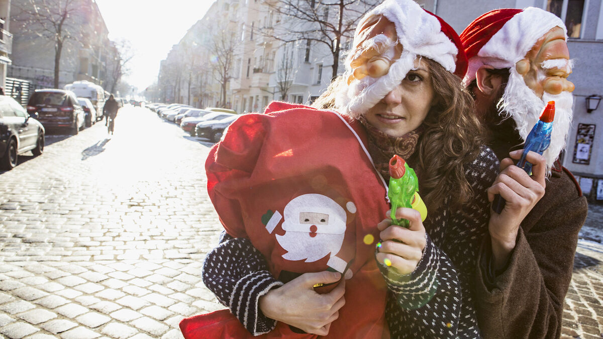 Comedy satire Santa robbers on street