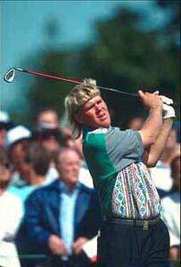 Golfer completing a swing and eyeing the path