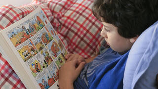 boy reading a graphic novel
