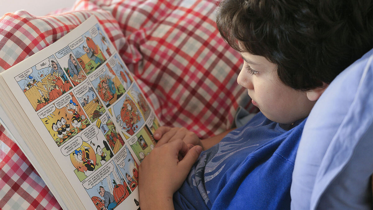 boy reading a graphic novel