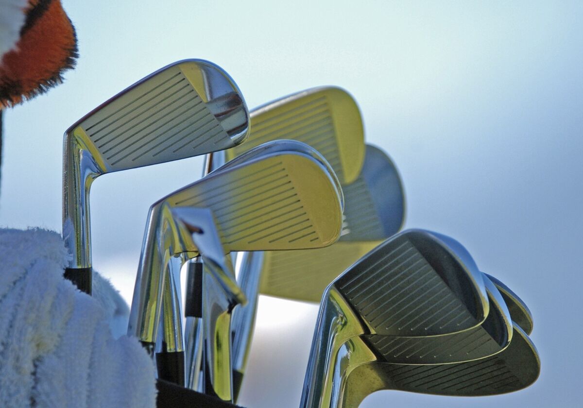 A set of irons in a golf bag