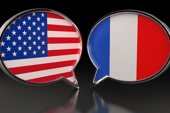 USA and France flags with Speech Bubbles