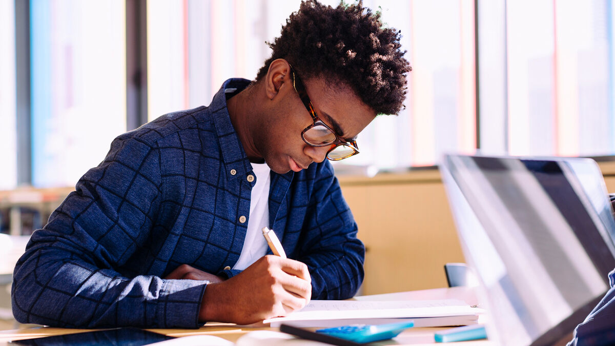 young man doing creative writing