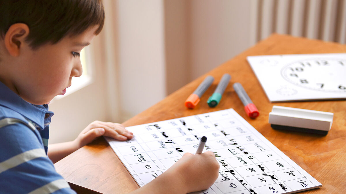 boy practicing spelling