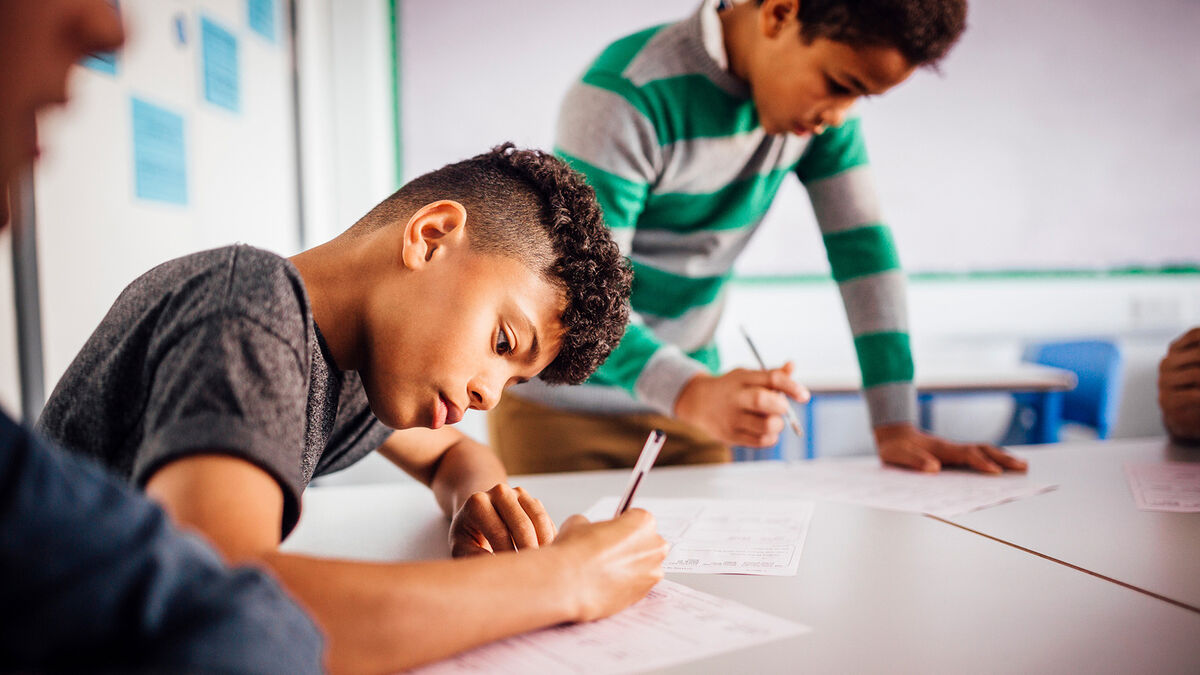 students doing sentence combining assignment in class