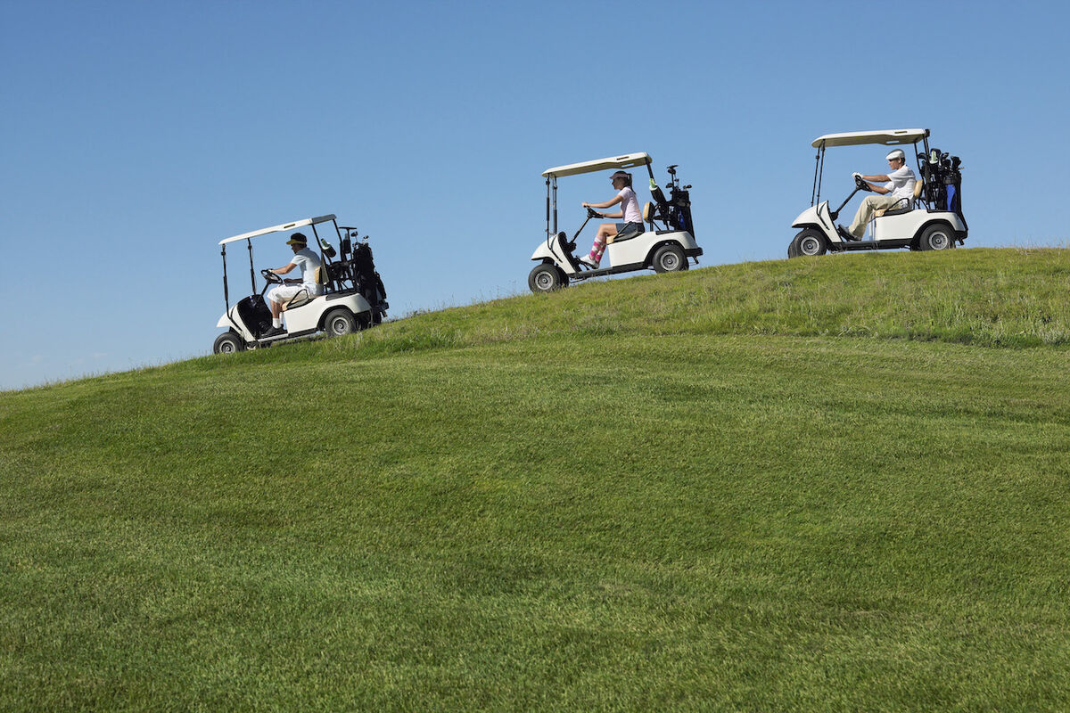 Golf carts on hilly course