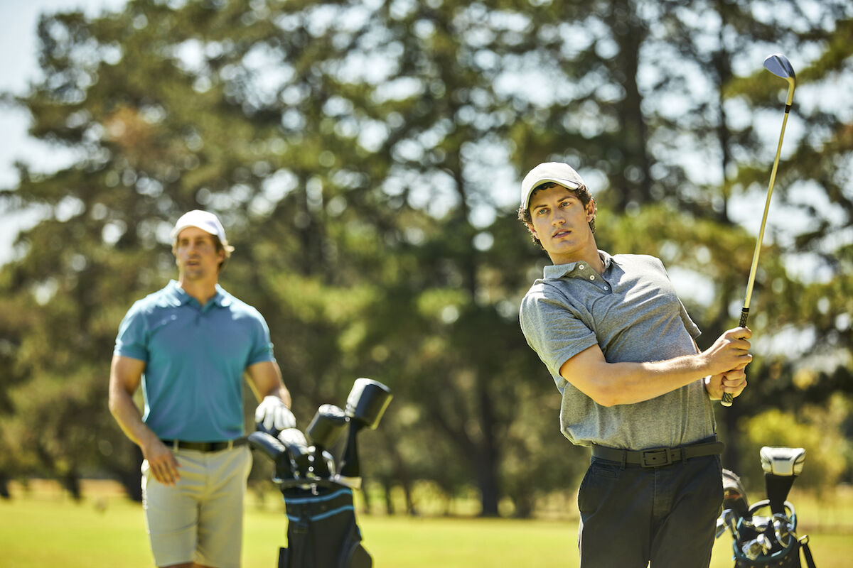 Two men watching golf shot