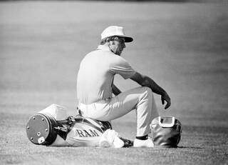Gary Player sitting on golf bag