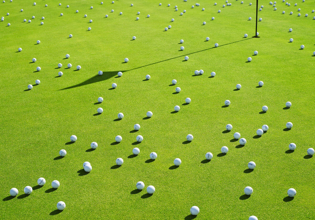Golf balls on putting green
