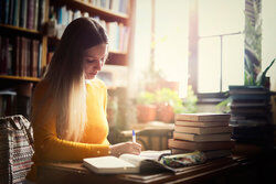 woman working on research paper