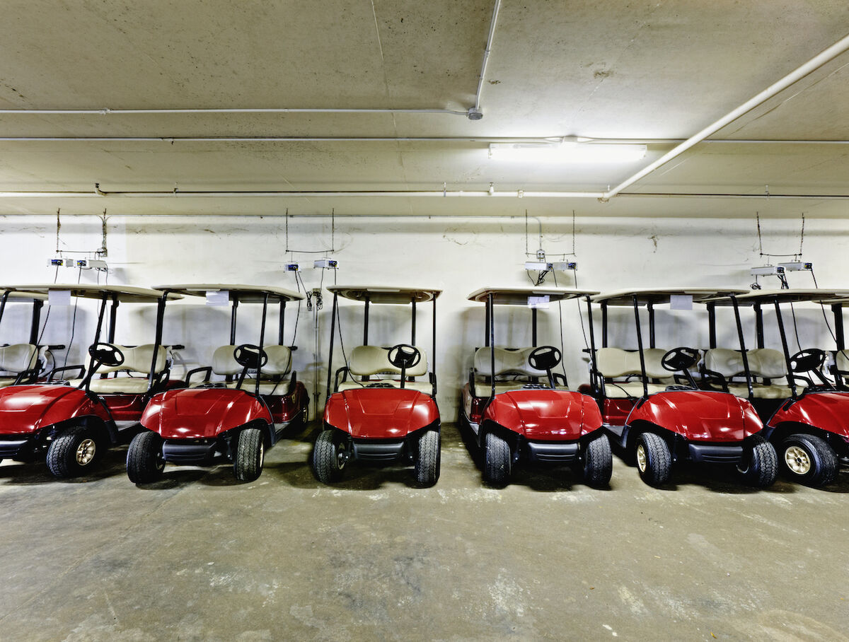 Red golf carts in garage