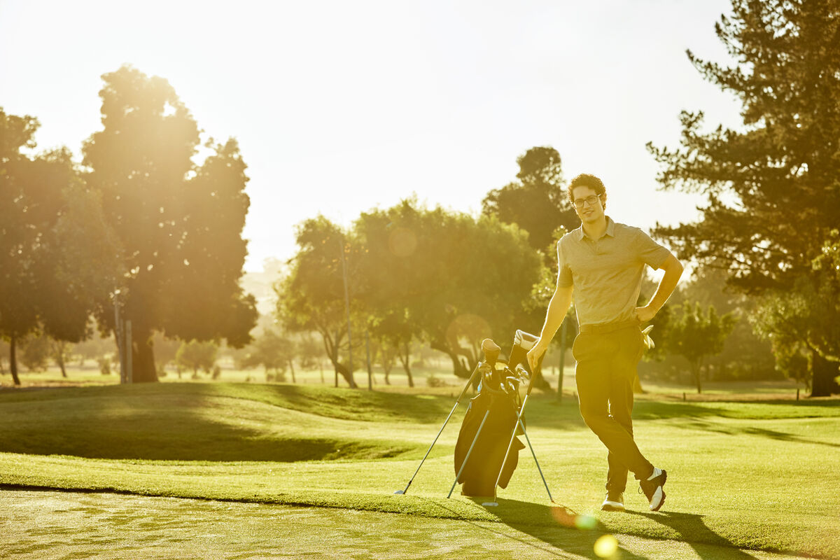 Golfer with bag just off the tee box