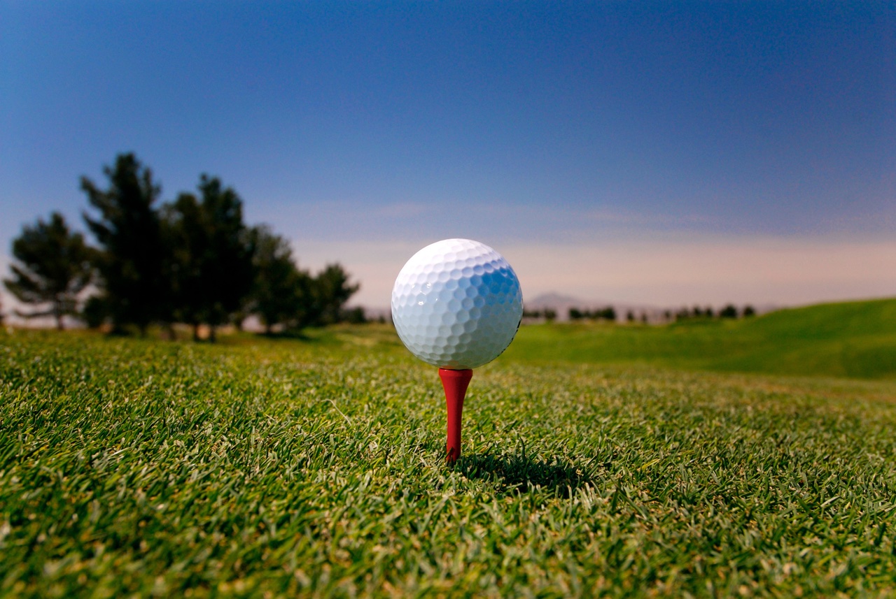 A golf ball sits on a tee