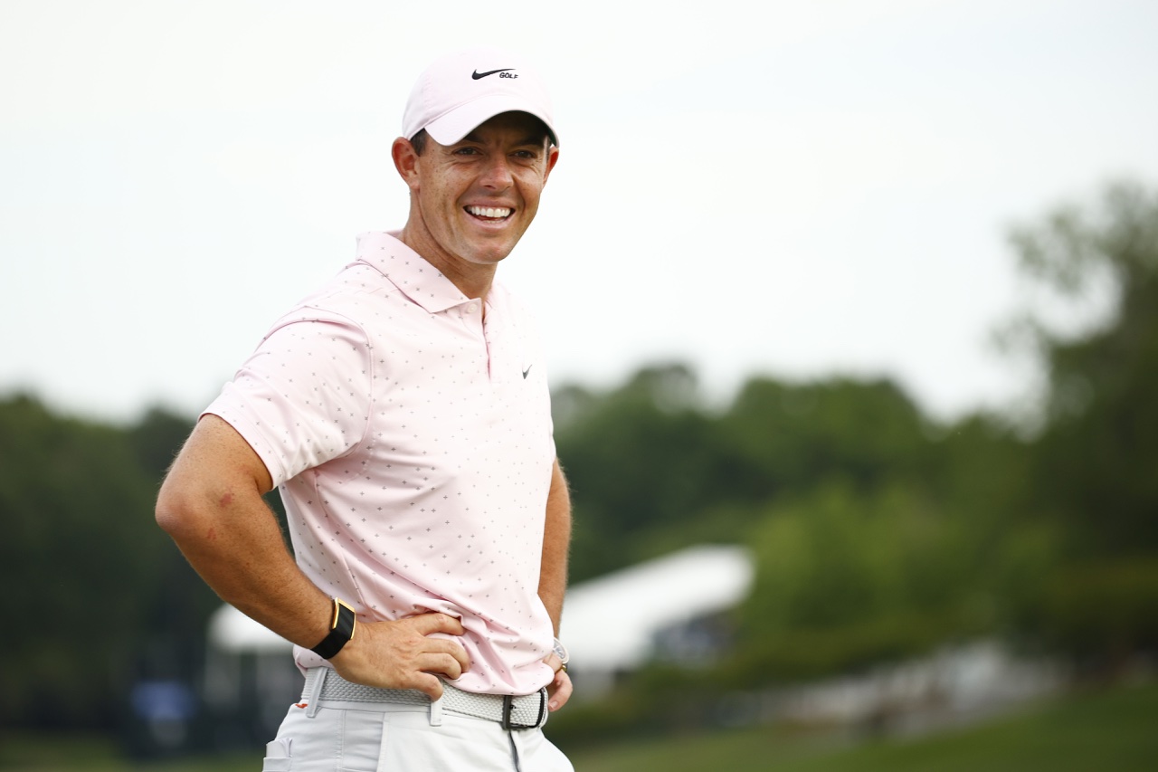 Rory McIlroy smiles with hands on hips