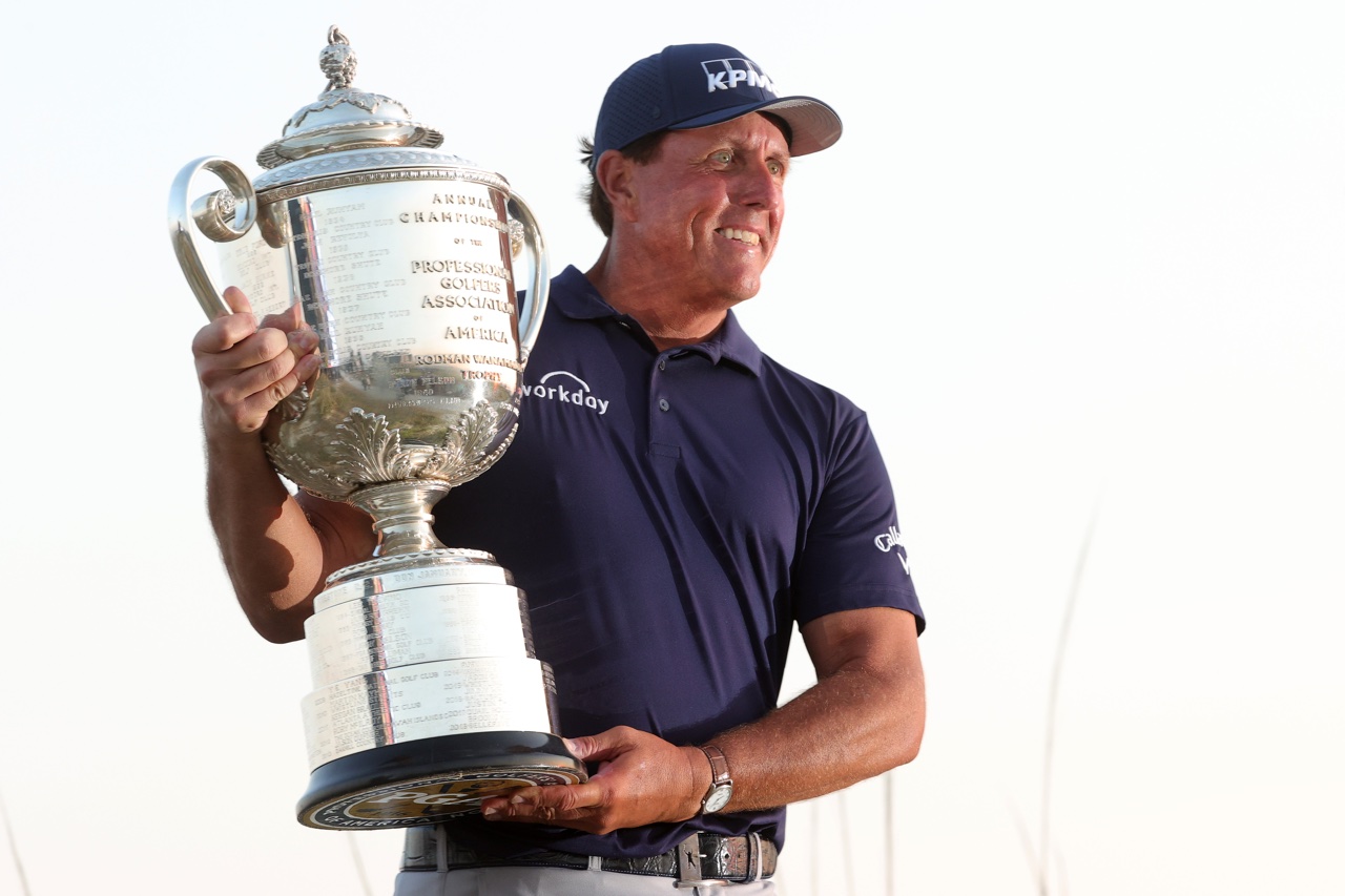 Phil Mickelson celebrates with the Wanamaker Trophy