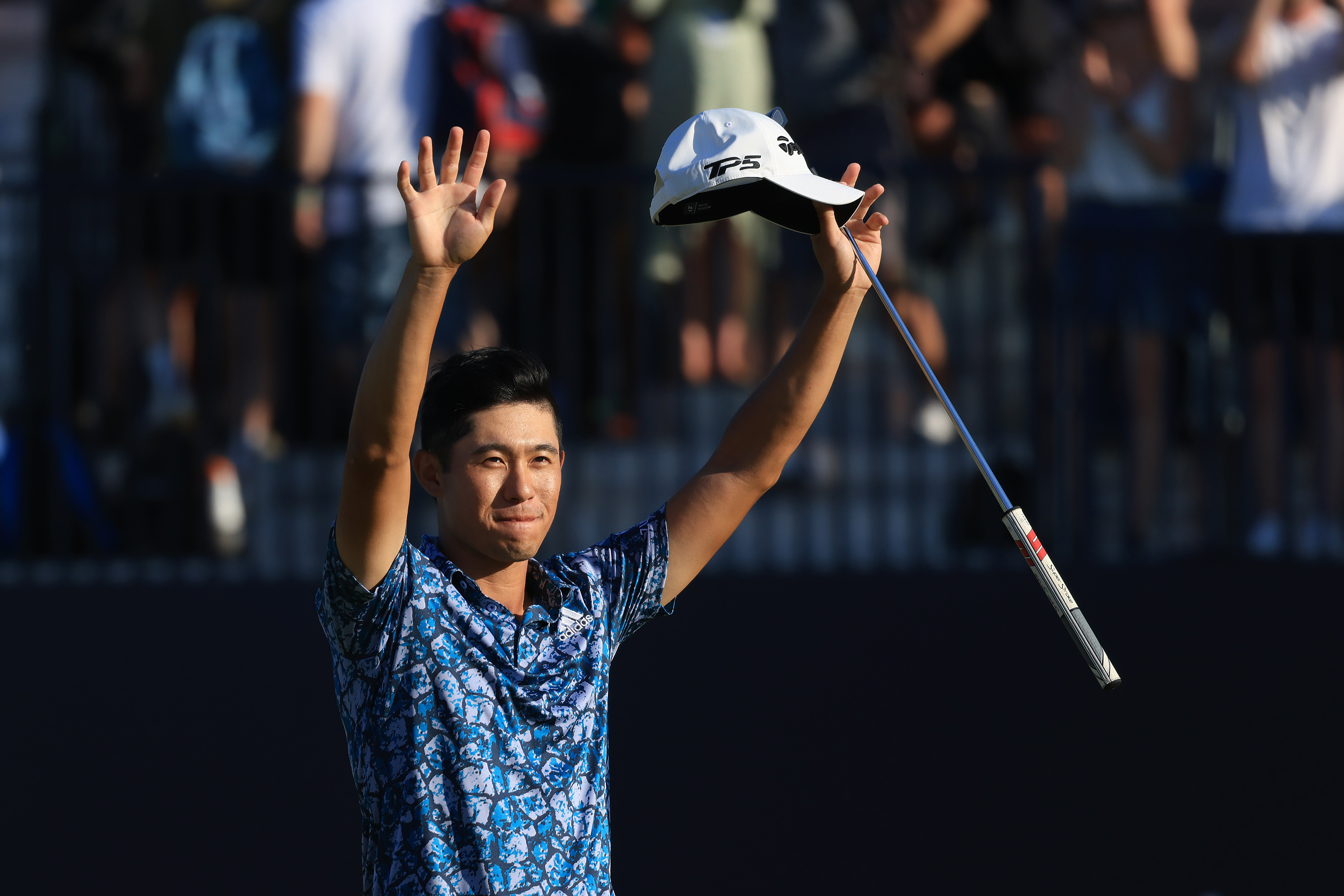 Collin Morikawa celebrates winning the Open