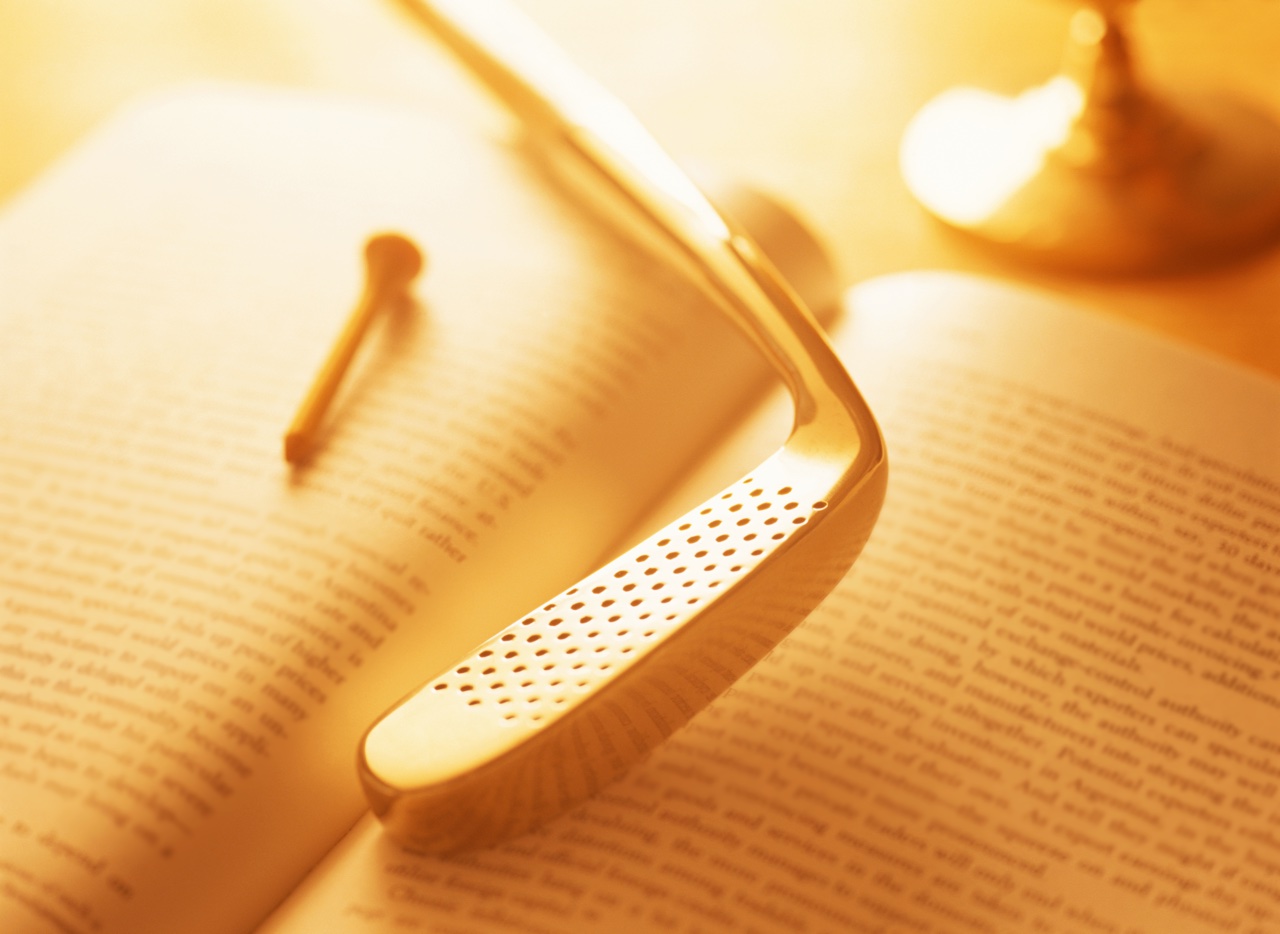 an open book and a golf club