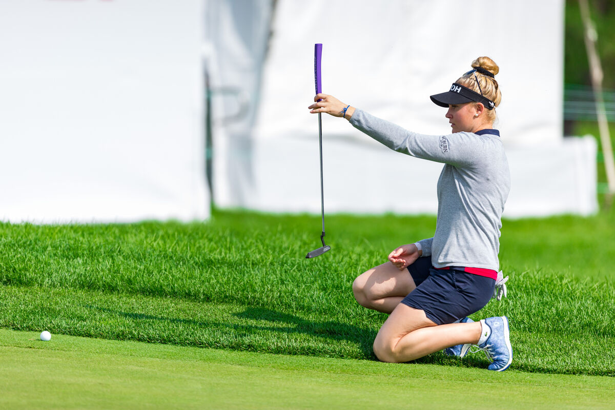 Charley Hull plumb bobs a putt