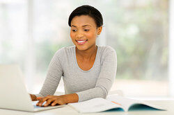 woman typing on laptop