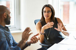 two people in conversation