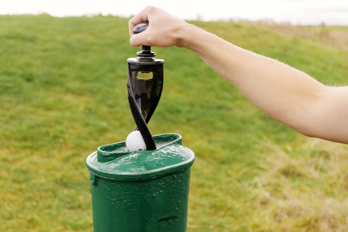 Traditional on-course golf ball washer