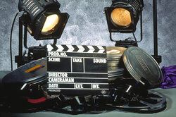 movie clap board with reels