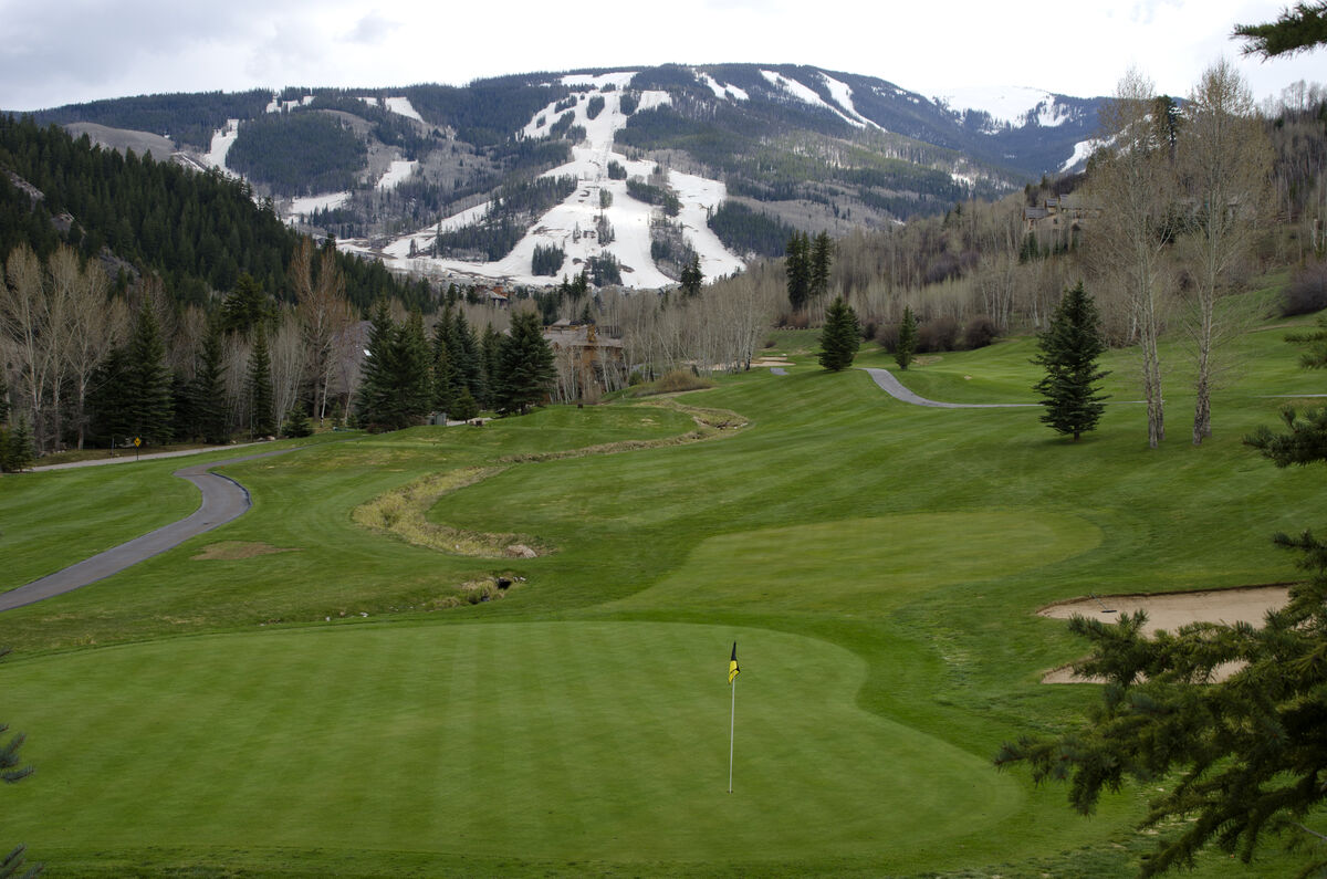 Colorado golf course with ski slopes in the background