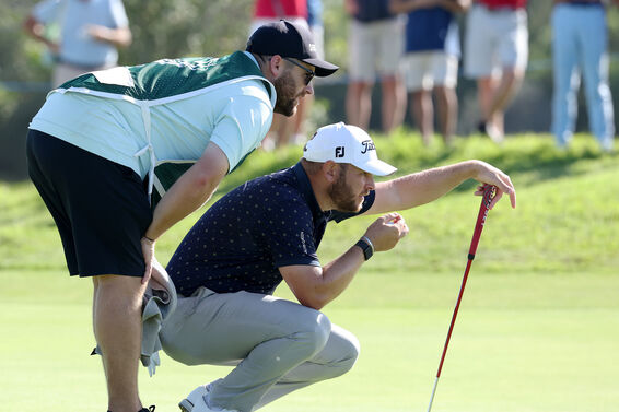 Caddie Sam Matton and player Jordan Smith