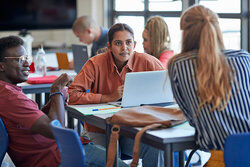 Students collaborating in library