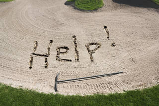 Sand Bunker with message that needs to be raked