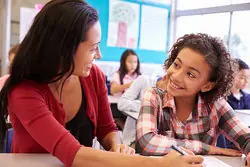 Teacher talking with student