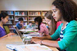 Student doing research in library