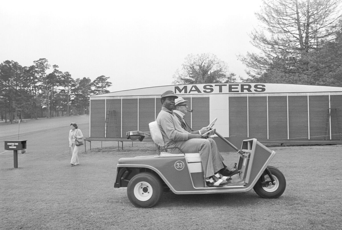 Lee Elder in 3-wheeled golf cart at the 1975 Masters