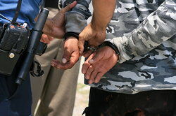 Image of a man being arrested