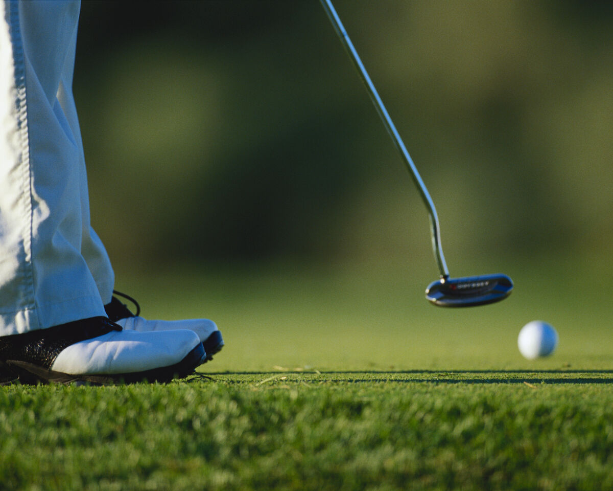 Golfer putt follow through