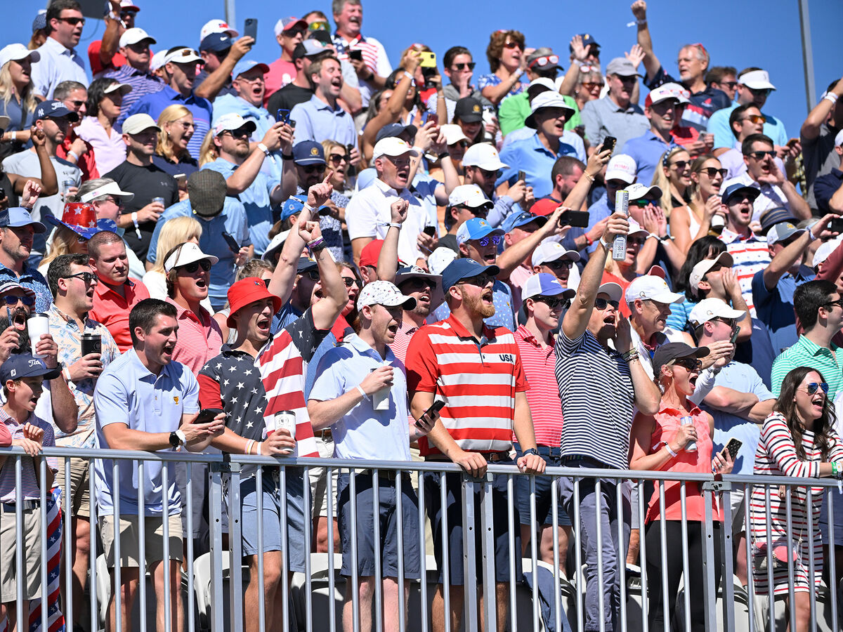 Golf spectators at the Presidents Cup wearing red, white and blue.