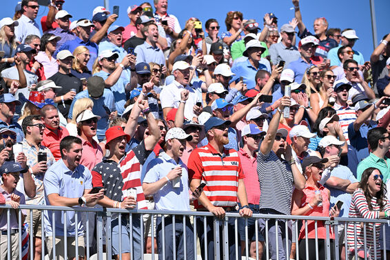 Golf spectators at the Presidents Cup wearing red, white and blue.