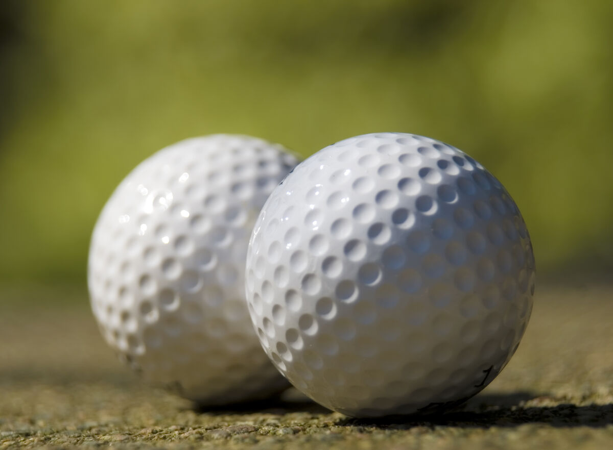 two golf balls side-by-side