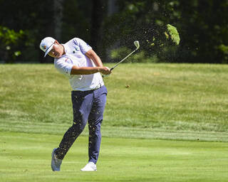 Golf divot swung in the air