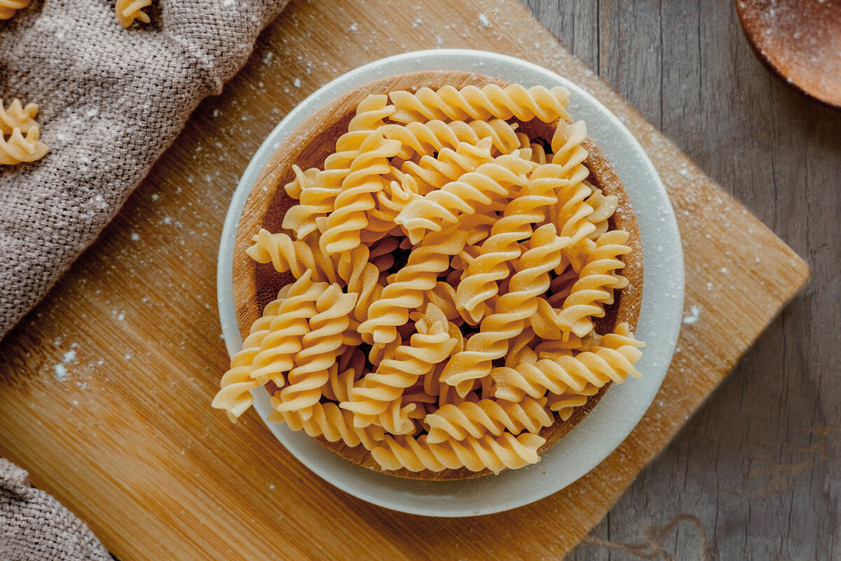 Fusilli in plate in bright kitchen